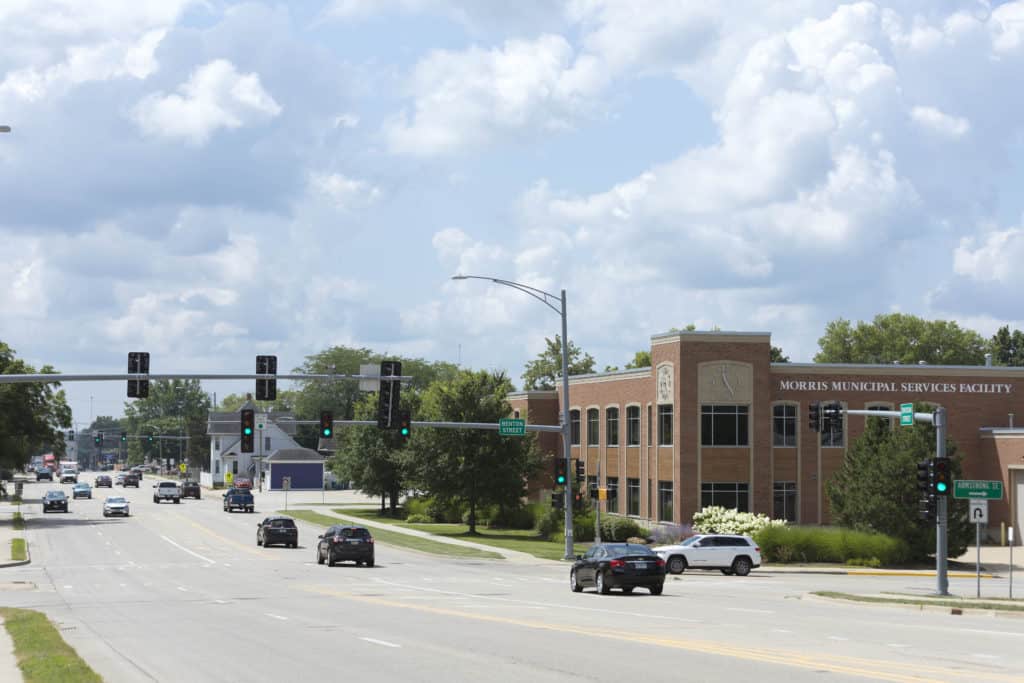 Morris IL city hall with street and trees