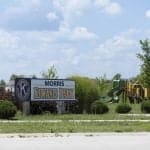 Morris Kiwanis Park sign and playground equipment.