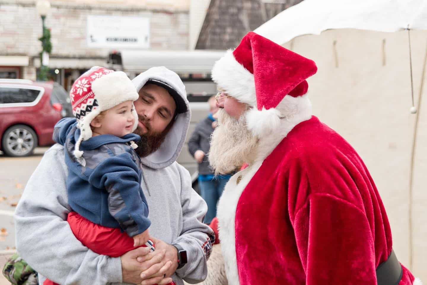 Family meeting Santa Claus outdoors